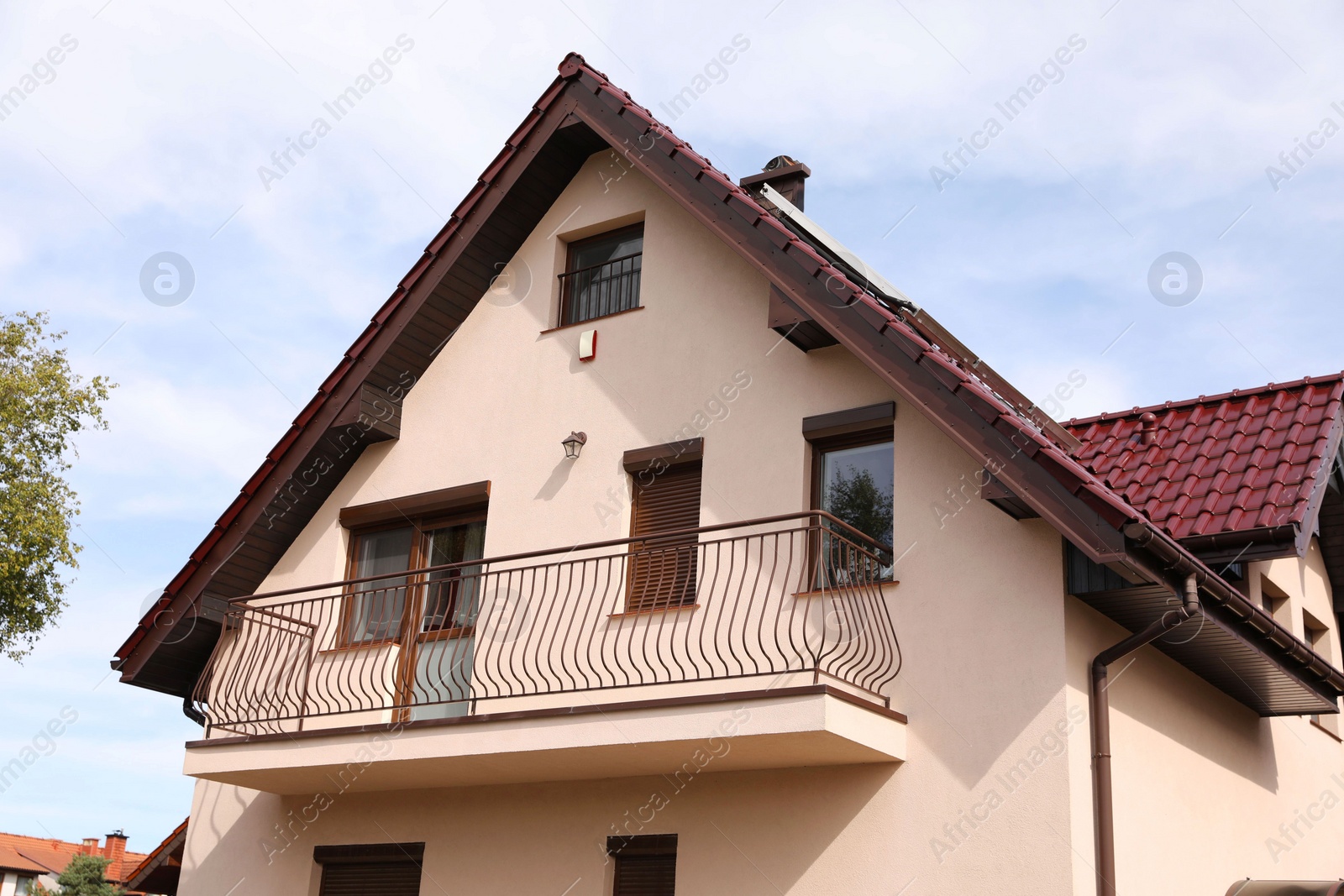 Photo of Exterior of beautiful modern house against cloudy sky