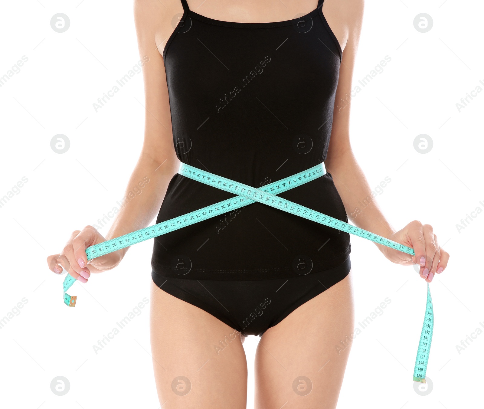 Photo of Slim woman measuring her waist on white background, closeup. Weight loss