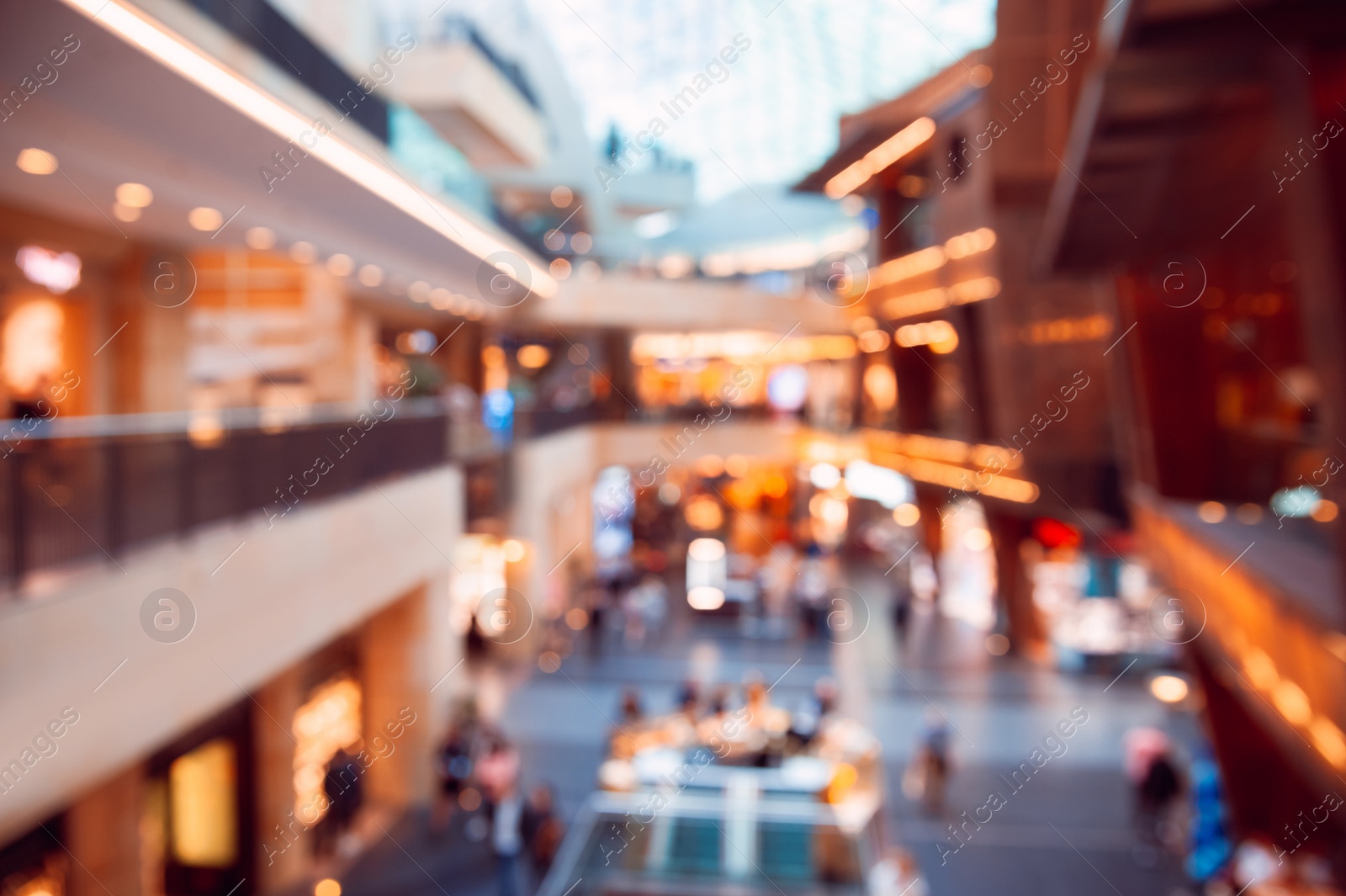 Photo of Big shopping mall with many stores, blurred view