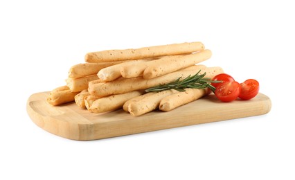Photo of Wooden board with delicious grissini, rosemary and tomatoes on white background