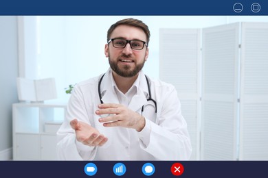 Pediatrician consulting patient online using video chat in clinic, view from webcam