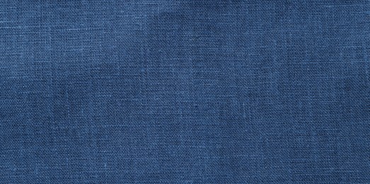 Photo of Texture of blue fabric as background, top view