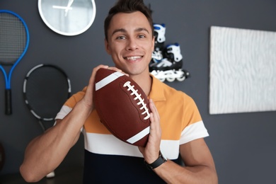 Photo of Portrait of sport blogger with football ball at home