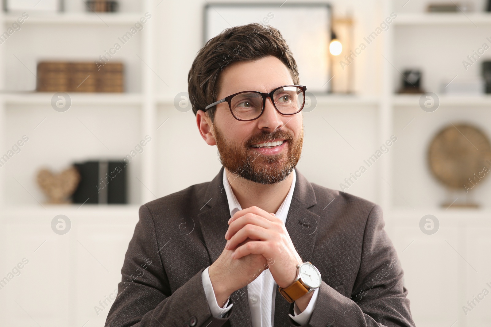 Photo of Happy businessman having online video call in office, view from web camera