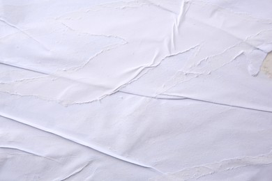 Photo of Texture of white ripped paper poster, closeup view