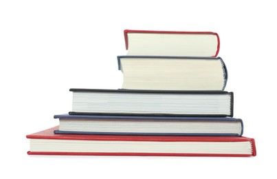 Stack of different hardcover books on white background