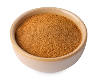 Photo of Dry aromatic cinnamon powder in bowl isolated on white