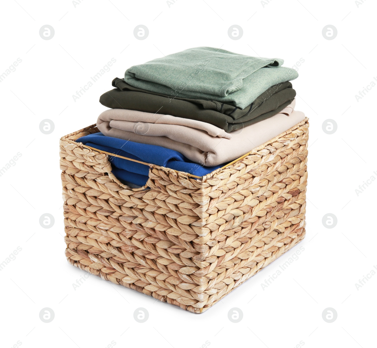 Photo of Wicker laundry basket with clean clothes isolated on white