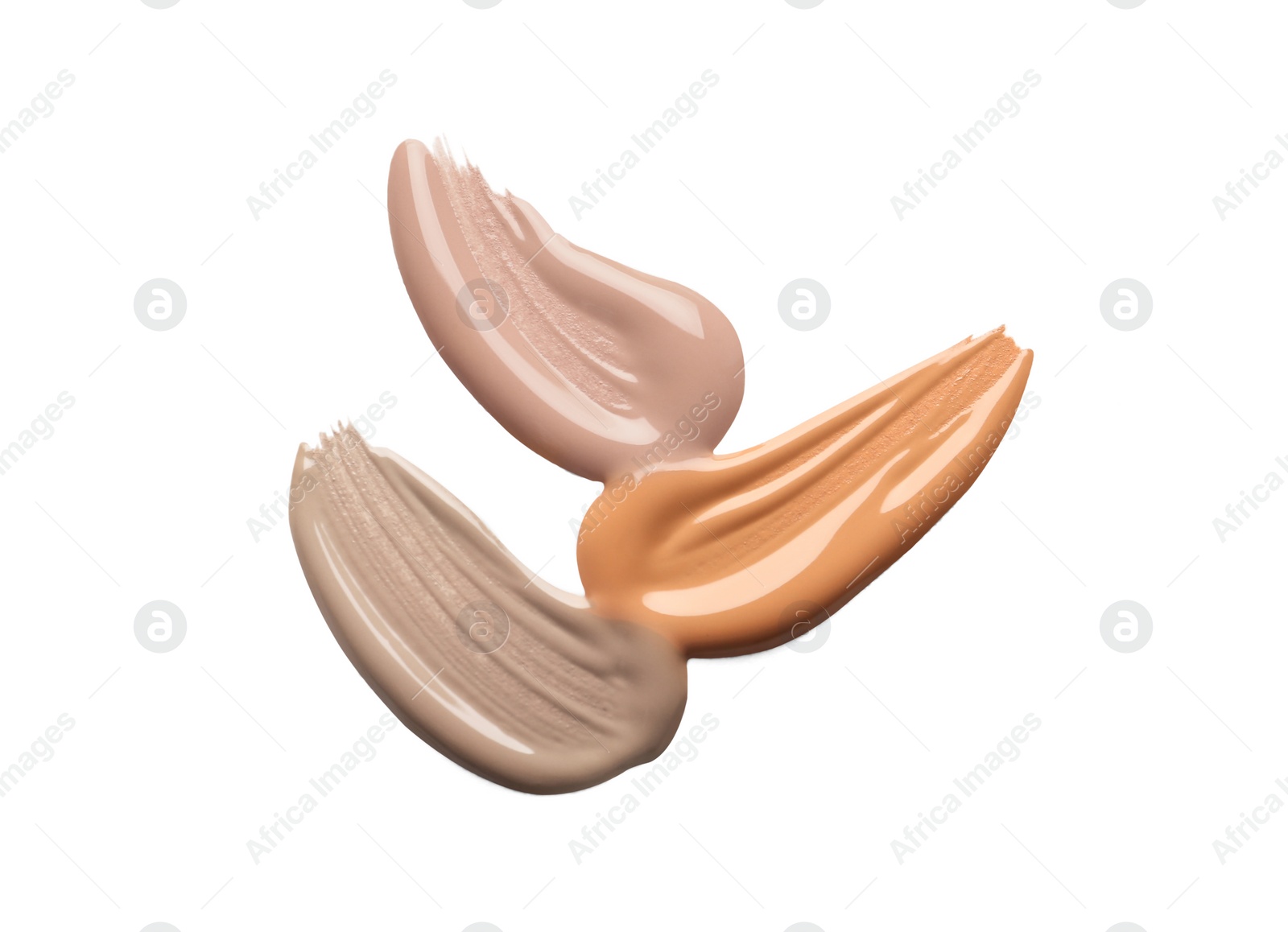 Image of Different shades of liquid foundation on white background, top view