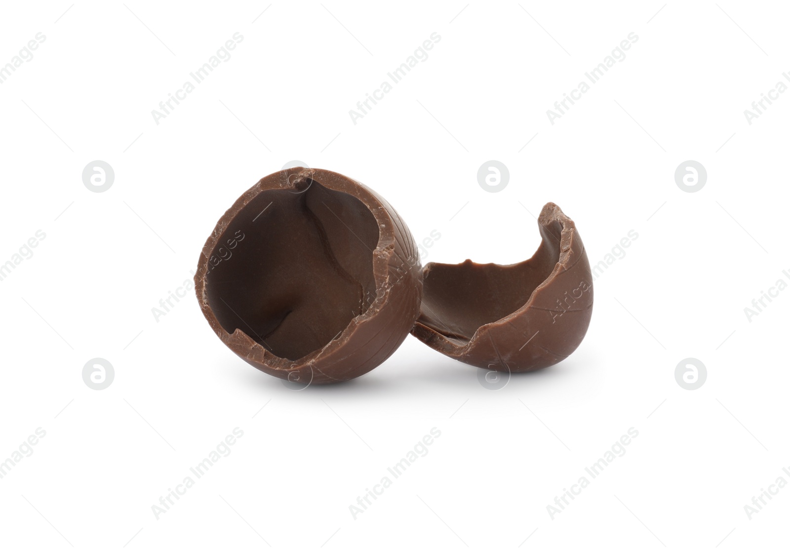 Photo of Broken milk chocolate egg on white background