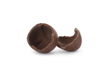 Photo of Broken milk chocolate egg on white background