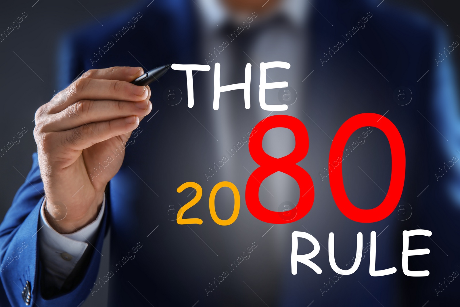 Image of Pareto principle concept. Man writing 80/20 rule, closeup