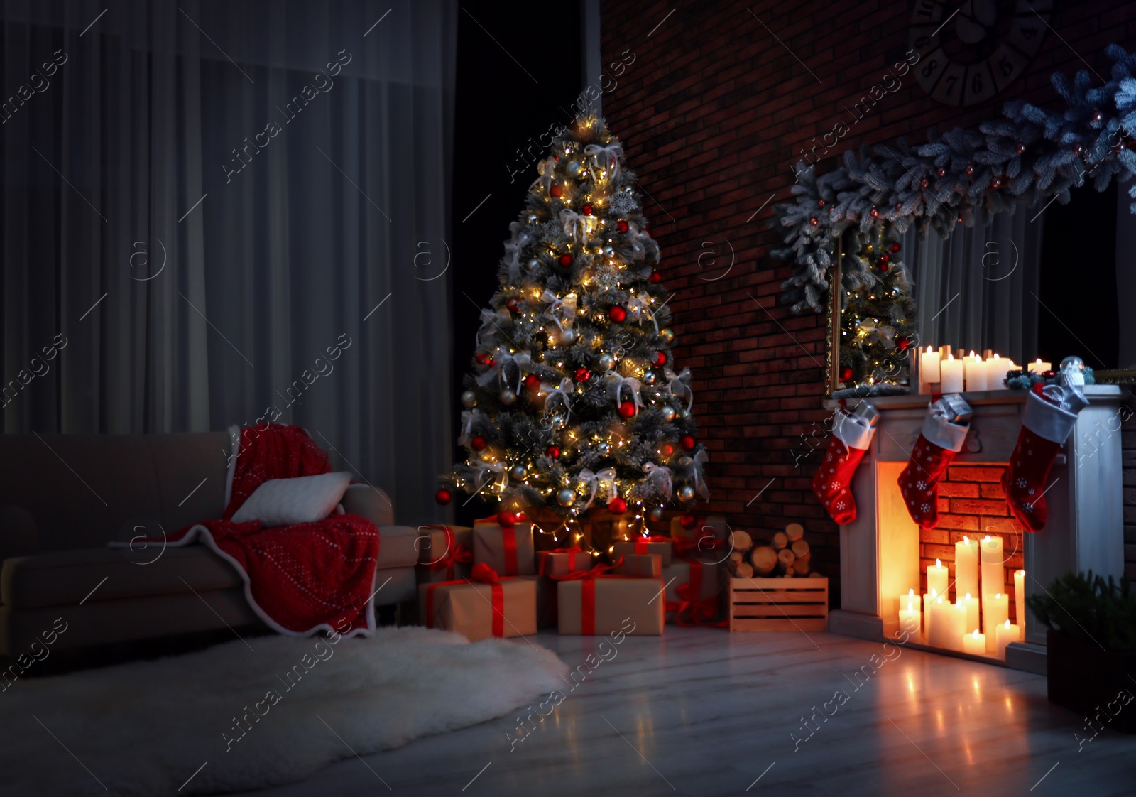 Photo of Stylish room interior with beautiful Christmas tree in evening