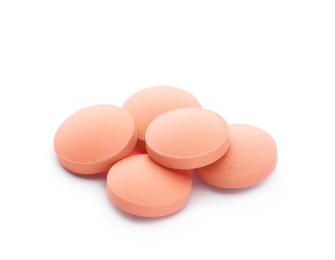 Pile of color pills on white background