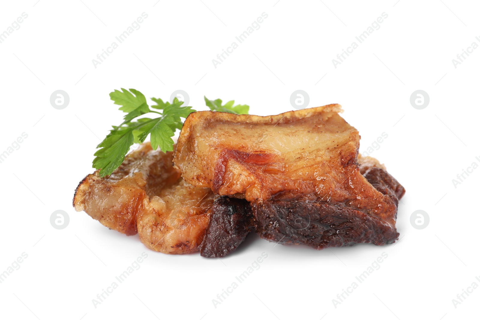 Photo of Tasty fried cracklings with parsley on white background. Cooked pork lard