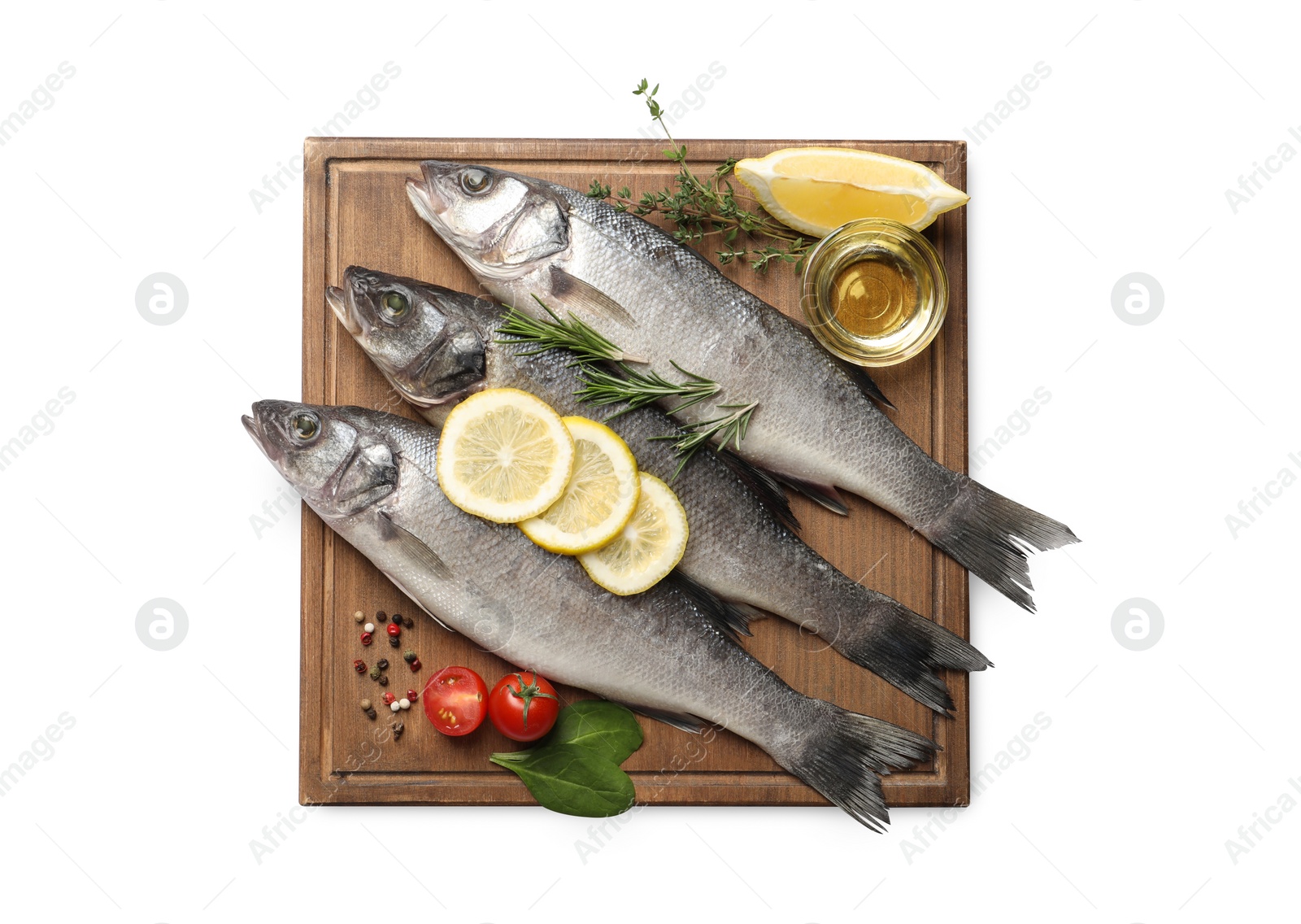 Photo of Tasty sea bass fish and ingredients isolated on white, top view