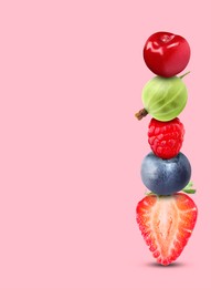 Image of Stack of different fresh tasty berries and cherry on pink background, space for text