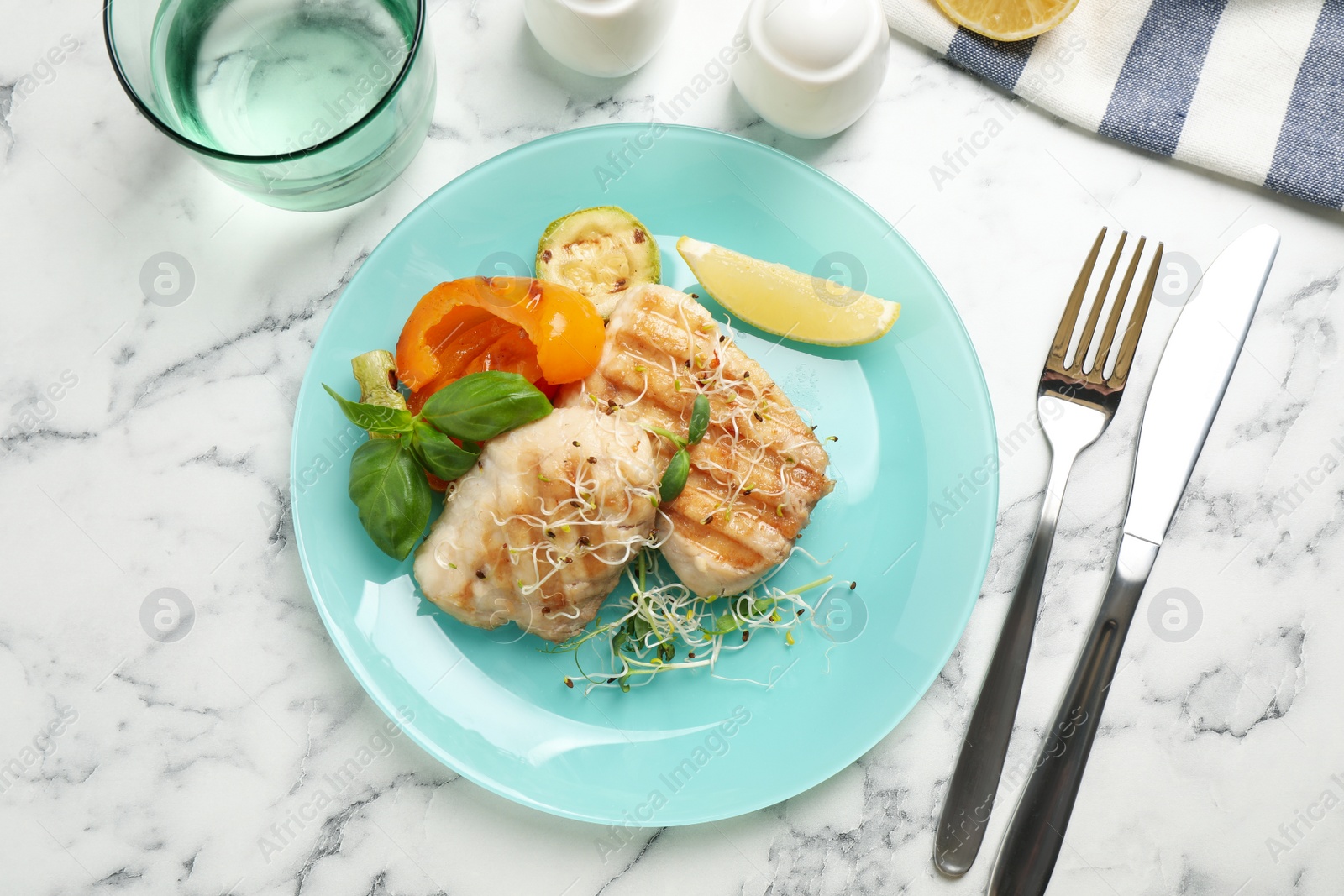 Photo of Flat lay composition with grilled fish on marble table