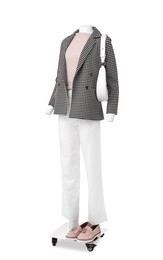 Photo of Female mannequin with bag dressed in stylish jacket, sweater and pants isolated on white