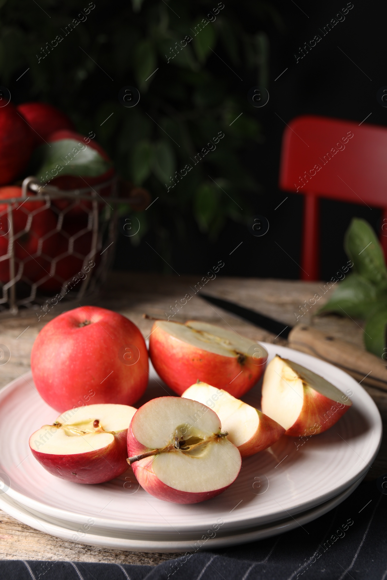 Photo of Fresh red apples on wooden table, closeup