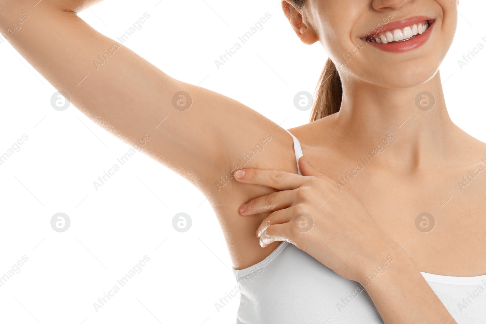 Photo of Young woman showing armpit with smooth clean skin on white background, closeup