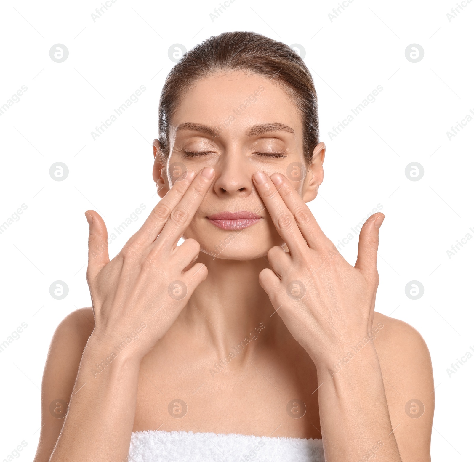 Photo of Woman massaging her face on white background