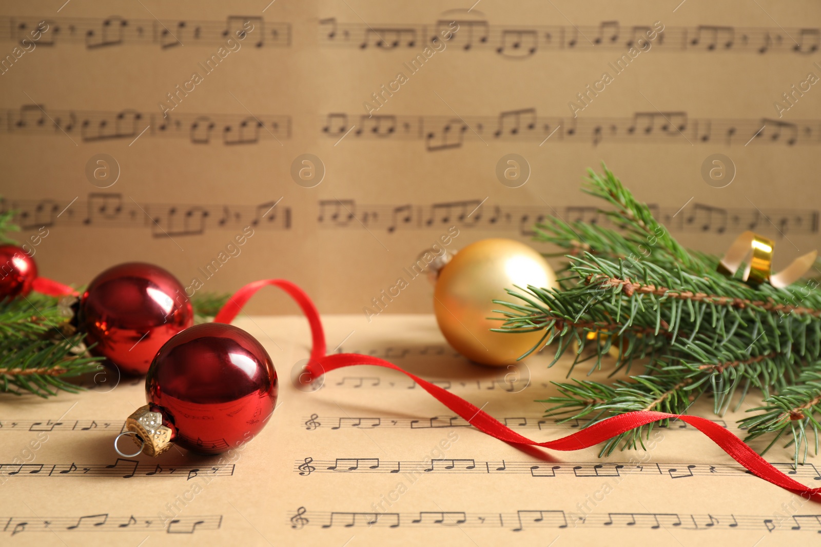 Photo of Composition with Christmas decorations on music sheets