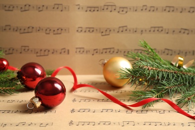 Composition with Christmas decorations on music sheets