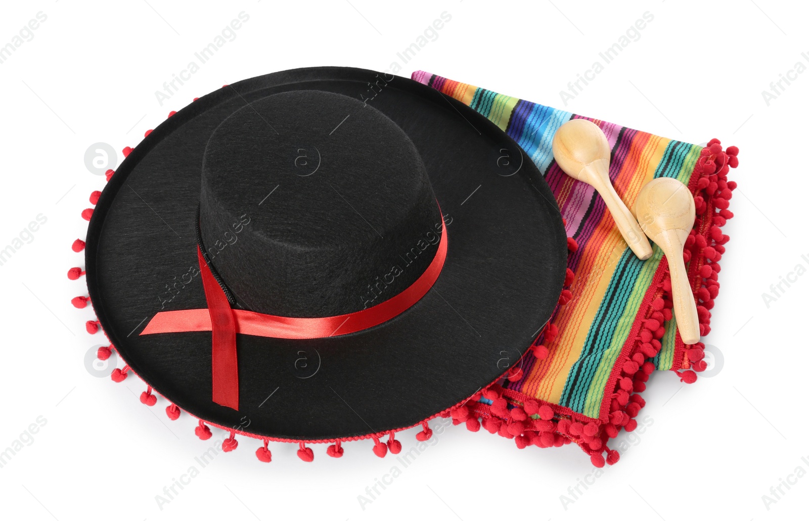 Photo of Mexican sombrero hat, maracas and colorful poncho isolated on white