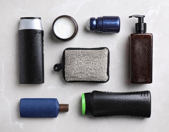 Photo of Flat lay composition with men's cosmetics on light grey marble background