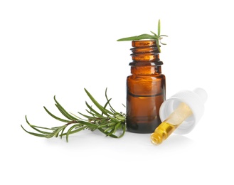 Small bottle with rosemary oil and fresh twig on white background