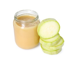Tasty baby food in jar and fresh squash isolated on white