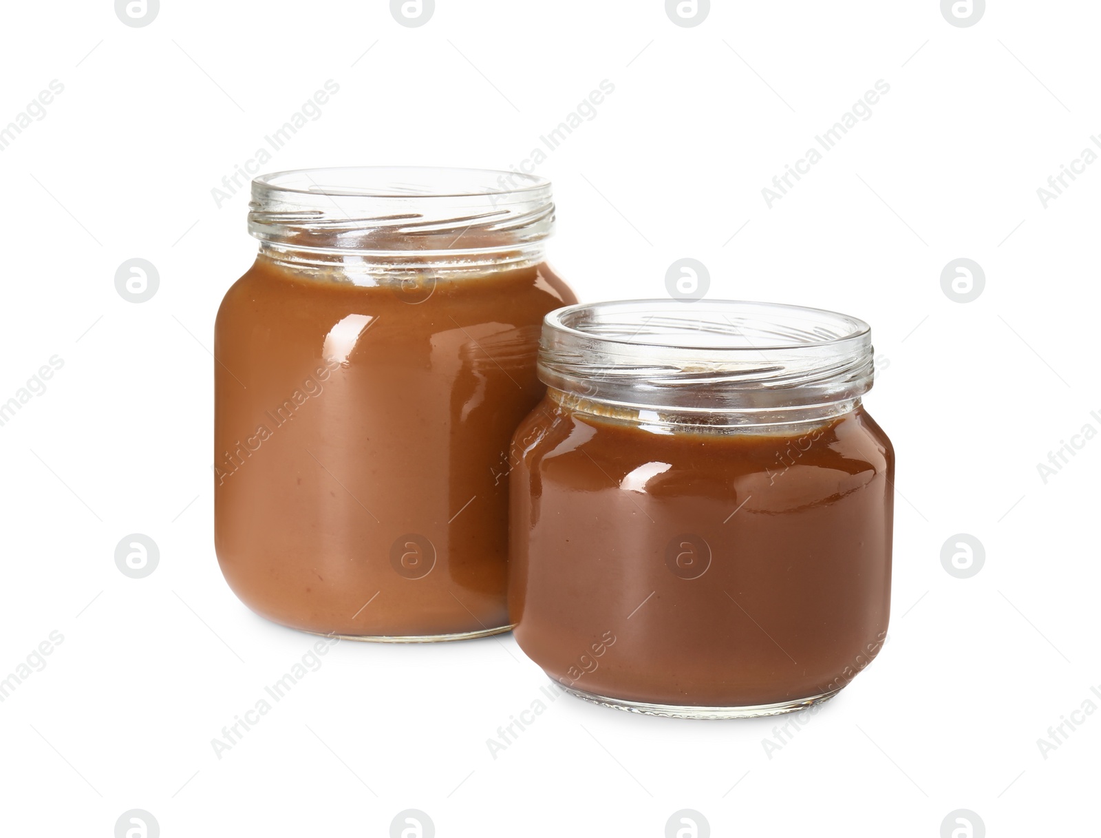 Photo of Baby food. Tasty healthy puree in jars isolated on white