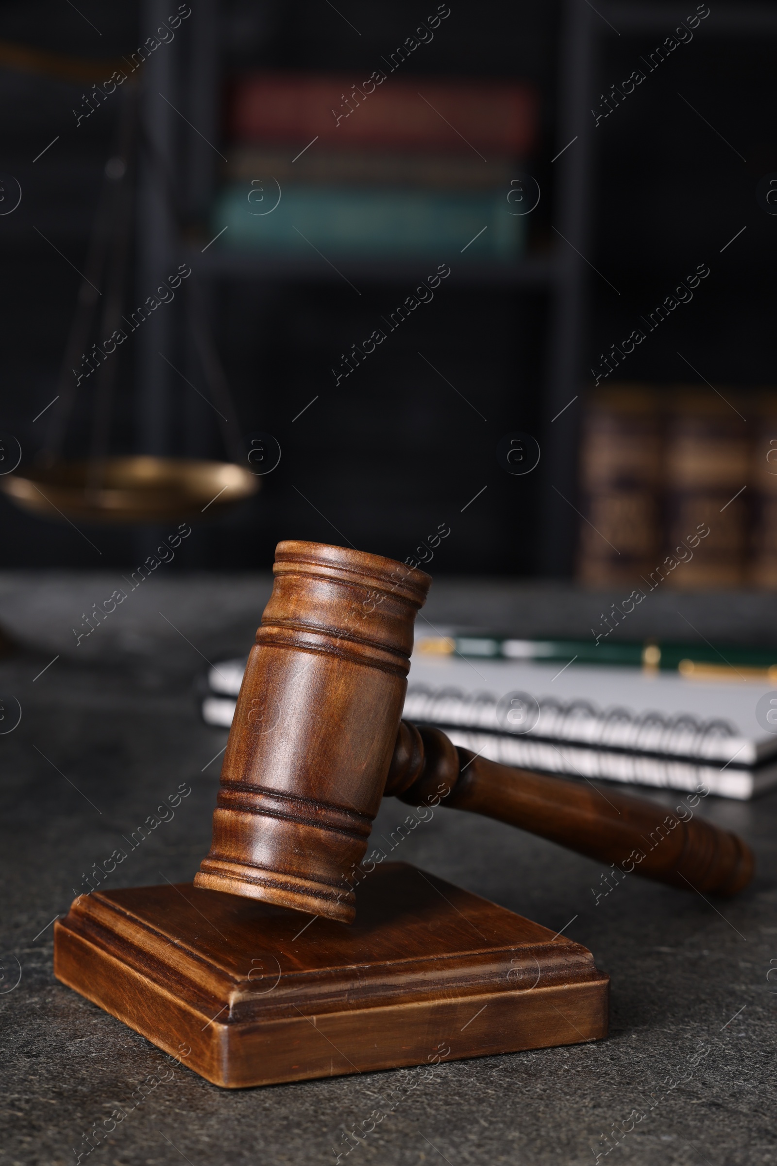 Photo of Law concept. Judge's gavel on grey textured table