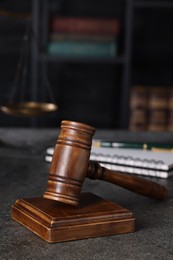 Photo of Law concept. Judge's gavel on grey textured table