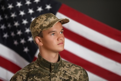 Male soldier in uniform against USA flag