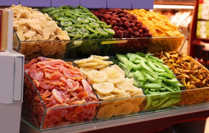 Photo of Assortment of delicious dried fruits at market