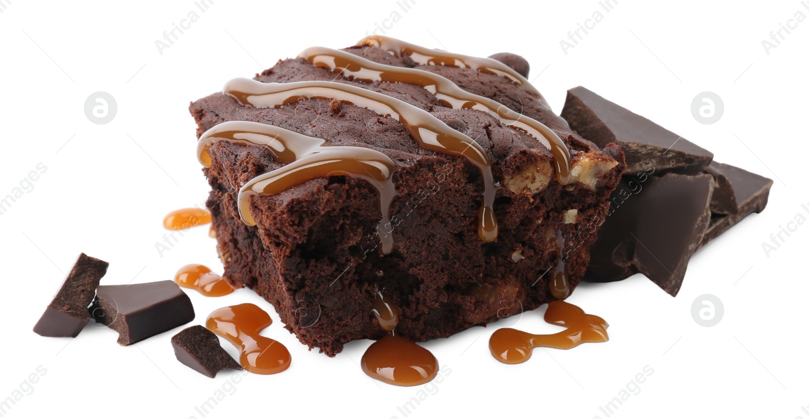 Photo of Delicious chocolate brownie with nuts and caramel sauce on white background