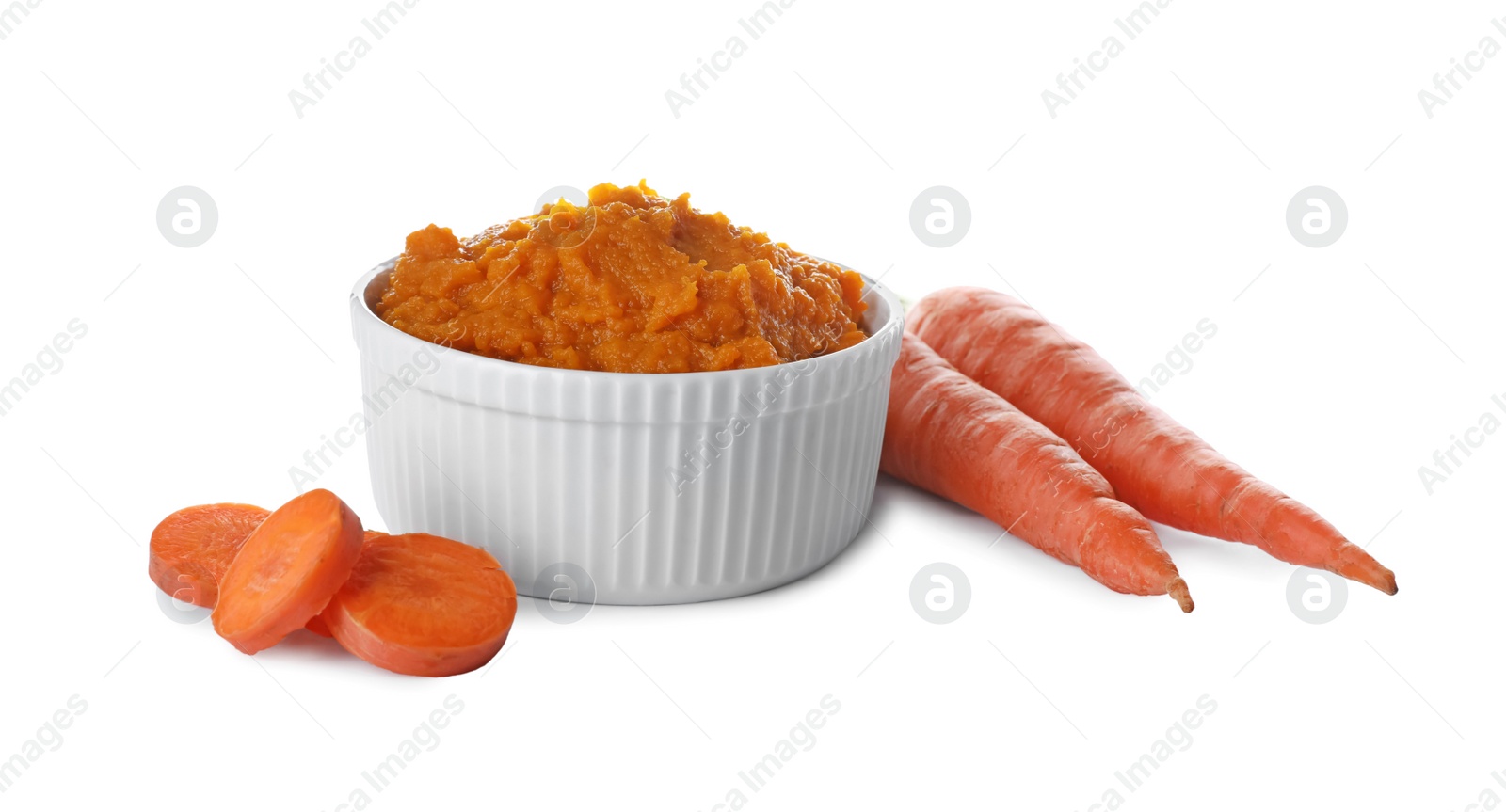 Photo of Delicious vegetable puree and fresh carrots on white background. Healthy food