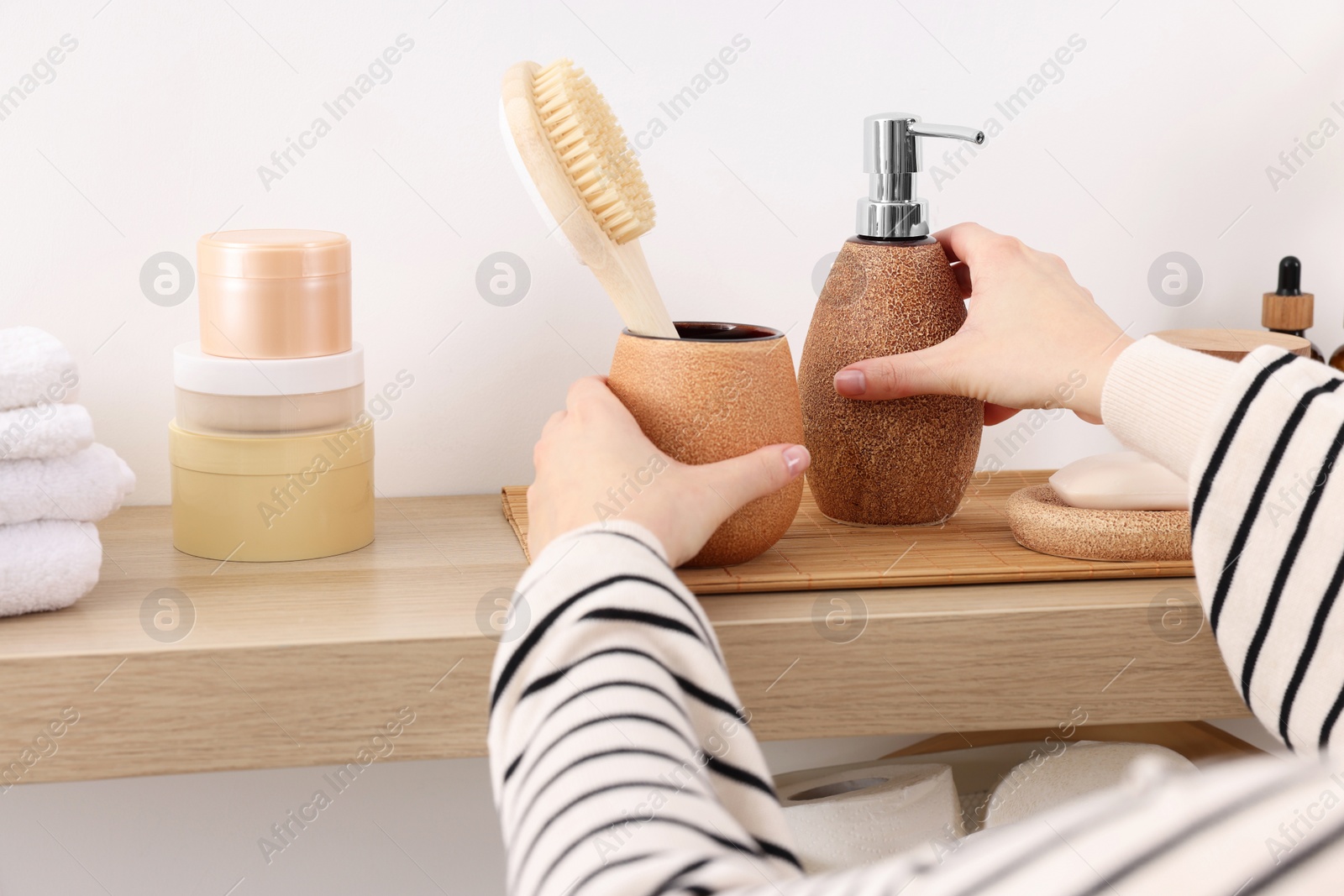 Photo of Bath accessories. Woman with different personal care products indoors, closeup