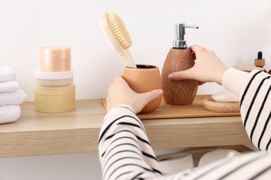 Photo of Bath accessories. Woman with different personal care products indoors, closeup