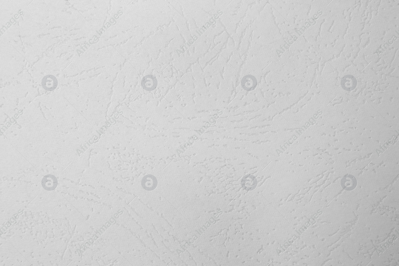 Photo of Texture of white paper sheet as background, top view