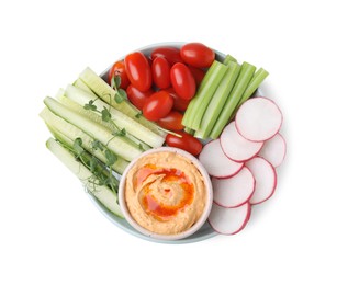 Plate with delicious hummus and fresh vegetables on white background, top view