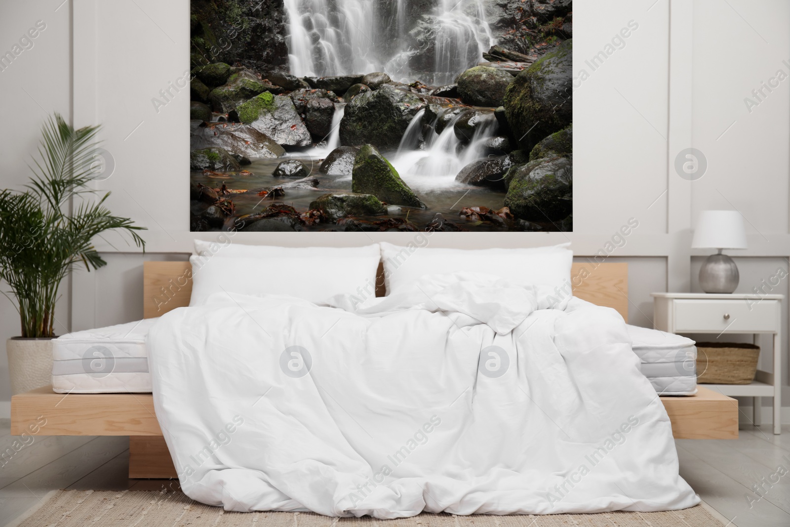 Image of Light bedroom. Interior with comfortable bed and mountain landscape wallpapers