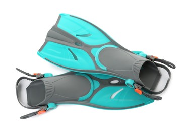 Pair of turquoise flippers on white background, top view