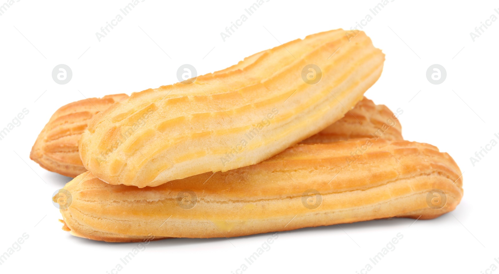 Photo of Three fresh delicious eclairs isolated on white