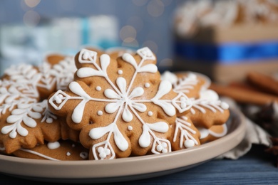 Photo of Delicious Christmas cookies on blue wooden table, closeup