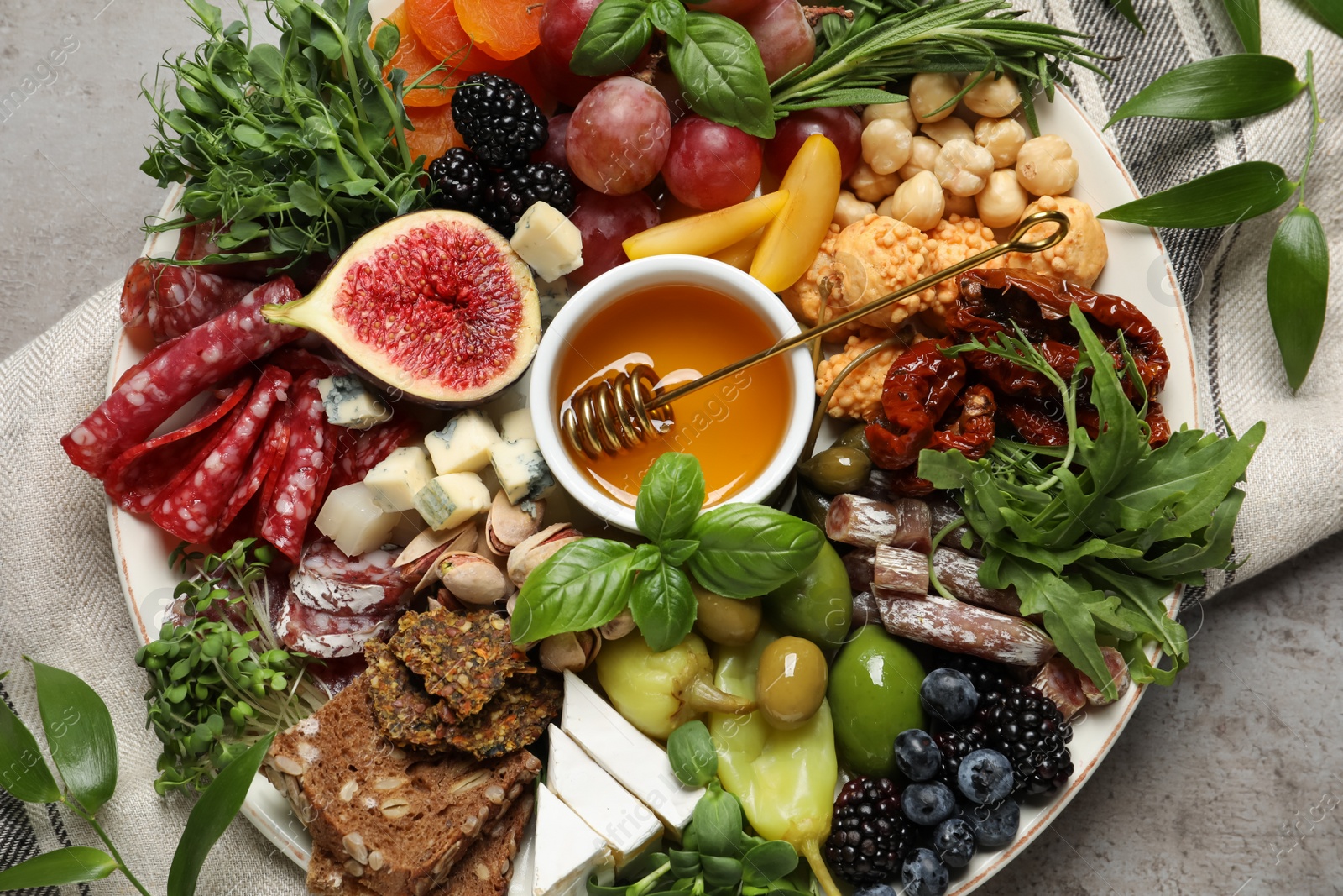 Photo of Set of different delicious appetizers served on light grey table, flat lay