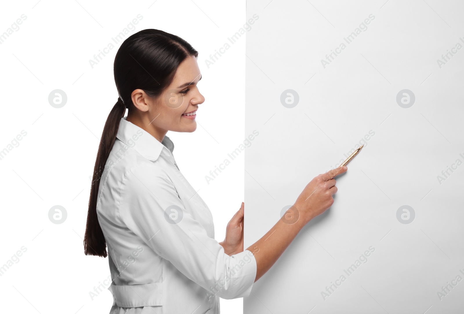 Photo of Ophthalmologist pointing at blank banner on white background, space for text