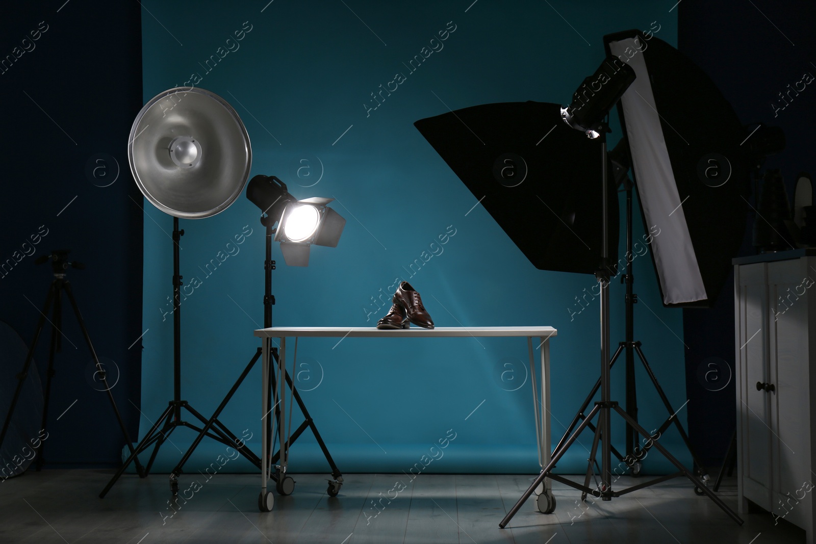 Photo of Shooting of men's shoes for product promotion in photo studio